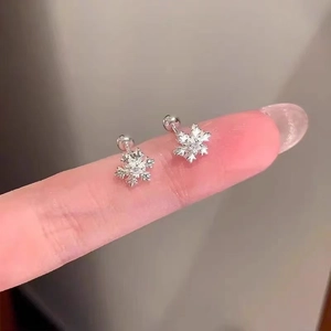Detailed view of 925 sterling silver snowflake earrings with a secure screw-back design