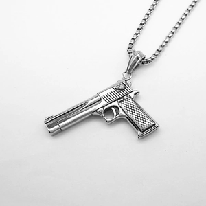 Detailed close-up of a silver punk style desert eagle handgun pendant with box chain