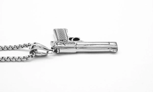 Macro shot of hip-hop style large pistol pendant with durable steel box chain