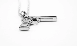 Detailed close-up of a silver pistol pendant featuring textured grip and steel chain