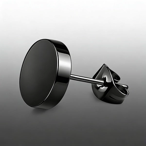 Detailed macro view of black stainless steel round stud earring with butterfly backing