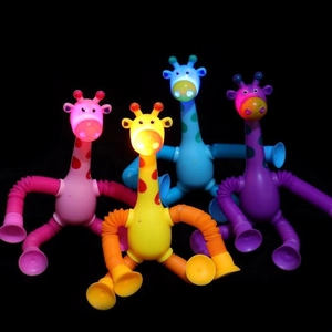Detail of light-up giraffe suction cup toys with glowing heads and flexible tubes