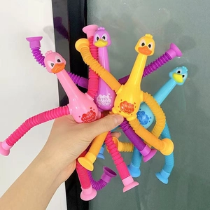Detail of colorful stretchable duck pop tubes with suction cups in a flexible hand-held pose