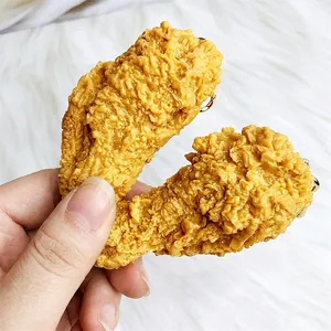 Realistic fried chicken drumstick keychain with crispy texture and golden metal ring