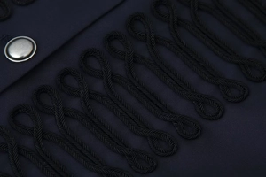 Close-up of military jacket detail featuring intricate braided rope frogging and silver buttons