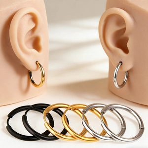 Three-color minimalist stainless steel hoop earring set in black, gold, and silver finishes