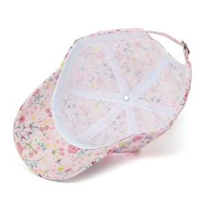 Detailed top view of a pink floral baseball cap showing inner lining and stitching