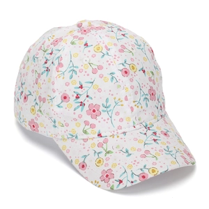 Close-up of floral baseball cap with pink flower and red cherry print on white fabric