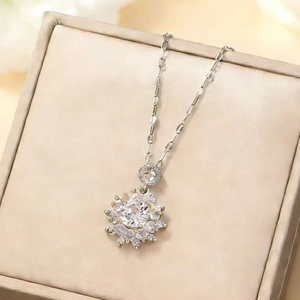 Sunflower zircon pendant necklace in silver stainless steel on beige jewelry box