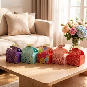 Set of 5 laser-cut floral wedding favor boxes with elegant golden butterfly top closures