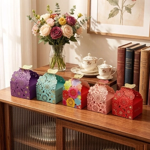 Detailed laser-cut floral candy boxes with 3D butterfly lids in various colors