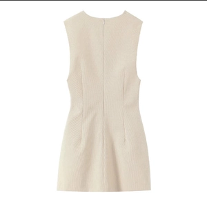 Detail of sleeveless striped mini dress back showing zipper closure and textured fabric