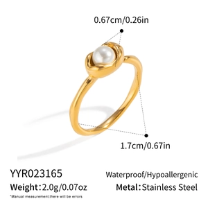 Detailed macro view showing the 1.7cm inner diameter and 0.67cm pearl of the gold ring