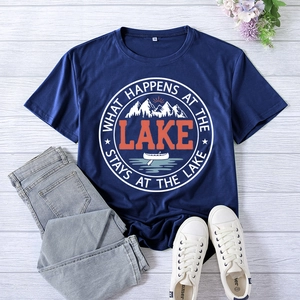 Detail of printed navy blue lake t-shirt laid flat on white wood background