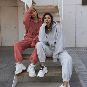 Cozy oversized women's two-piece tracksuit with hoodie and joggers in red and grey