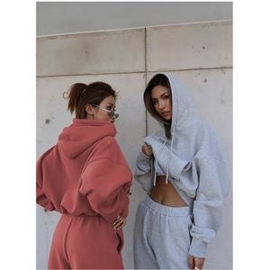 Close-up of thick cotton fabric texture on hooded sweatshirt and jogger pants set