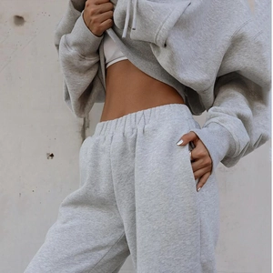 Detail of light grey cotton fleece track suit showing ribbed cuffs and high waist design