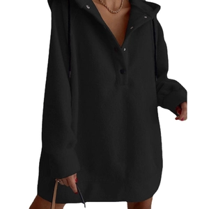 Detail of black hooded sweatshirt dress with buttoned placket and adjustable drawstrings
