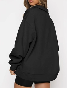 Detail of ribbed cuffs and oversized hood on black drop shoulder minimalist hoodie
