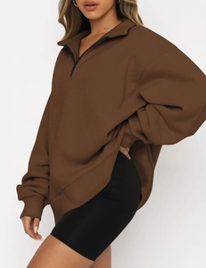 Detail of coffee brown quarter-zip sweatshirt with high collar and soft brushed fabric