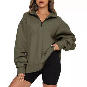 Women olive green half-zip oversized sweatshirt paired with black cycling shorts set
