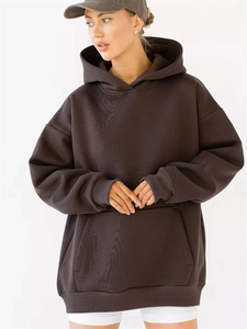 Close-up of a brown oversized hoodie with drop shoulders and a large kangaroo pocket