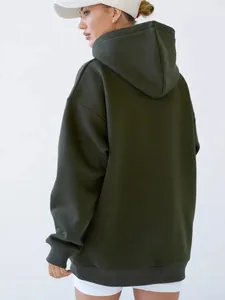 Detail view of the deep olive green oversized hoodie back with ribbed cuffs and hem