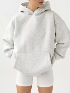 Detail view of heather grey oversized hoodie featuring drop shoulders and kangaroo pocket