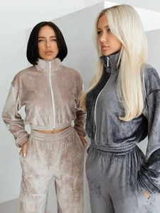 Detail of high-quality velvet tracksuit set featuring cropped zip jackets and pants
