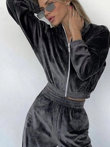 Detailed view of dark grey velour two-piece tracksuit with zipper and metallic sheen