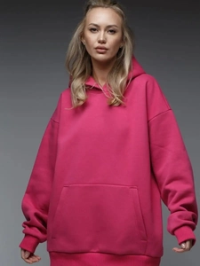 Detail of hot pink oversized hoodie with dropped shoulders and a kangaroo pocket