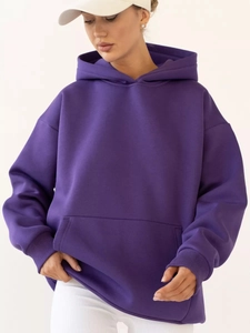Detailed view of purple oversized hoodie featuring drop shoulders and kangaroo pocket