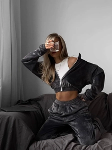 Detail of high-quality charcoal grey velvet tracksuit with zip-up hoodie and high-waist pants