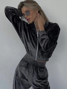 Detail of dark grey velvet texture on the zip-up hoodie and matching joggers set