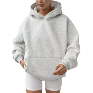 Women's oversized grey hoodie with long sleeves and front kangaroo pocket in casual style