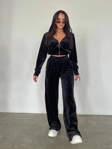 Detail of premium black velvet texture on hooded zipper sweatshirt and wide-leg pants set