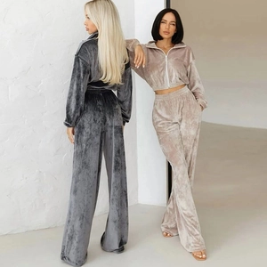 Women's 2-piece velvet tracksuit featuring zip-up hoodies and matching wide-leg trousers