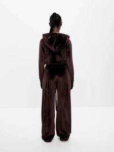Back view of brown velvet lounge set with hooded cardigan and wide-leg track pants