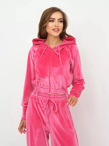 Detail of pink velvet two-piece hoodie set showing smooth zipper and fabric texture