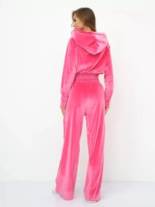 Detailed back view of a pink velvet tracksuit set with cropped hoodie and wide-leg pants