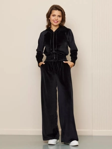 Close-up of black velvet hooded zip-up sweatshirt and drawstring wide-leg pants set