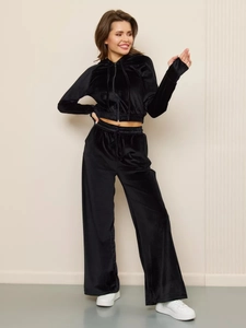 Detail view of premium black velvet tracksuit set with cropped zip hoodie and wide-leg pants