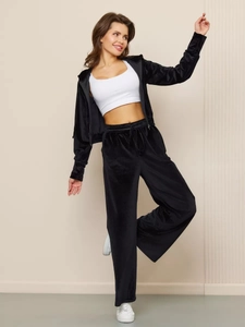 Detail of premium black velvet texture on zip-up hoodie and high-waist drawstring pants