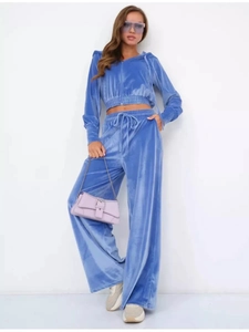 Bright blue velvet two-piece track suit with zip-up hoodie and high-waist wide-leg pants