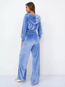 Back view of light blue velvet hooded sweatshirt and wide-leg pants two-piece set