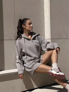 Close-up of light grey hooded sweatshirt and matching shorts set with thick fabric detail