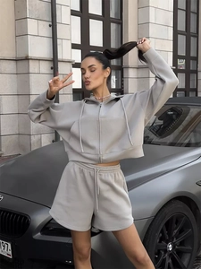 Detail of light gray zip-up hoodie and matching drawstring shorts in soft jersey fabric