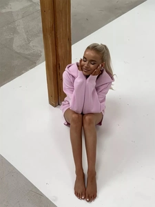 Close-up of pink oversized drop-shoulder hoodie set in a relaxed casual fit