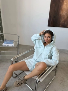 Detail of light blue hooded zip-up sweatshirt and drawstring shorts knit set