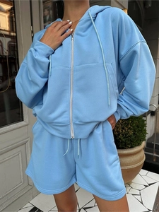 Detail of light blue two-piece lounge set with drawstring shorts and zip hoodie